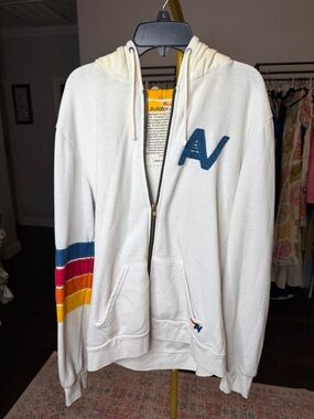 Aviator Nation Cream Zip Hoodie with Blue, Red, Orange & Yellow Sleeve Stripes